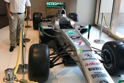 ViaLite's Amair Khan (Business Development Manager) with F1 car